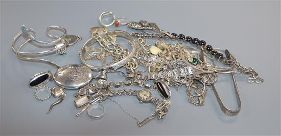 A collection of assorted silver and white metal jewellery etc. including rings, bracelets and sugar tongs.